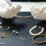 Hand gently cleaning gold-plated necklace